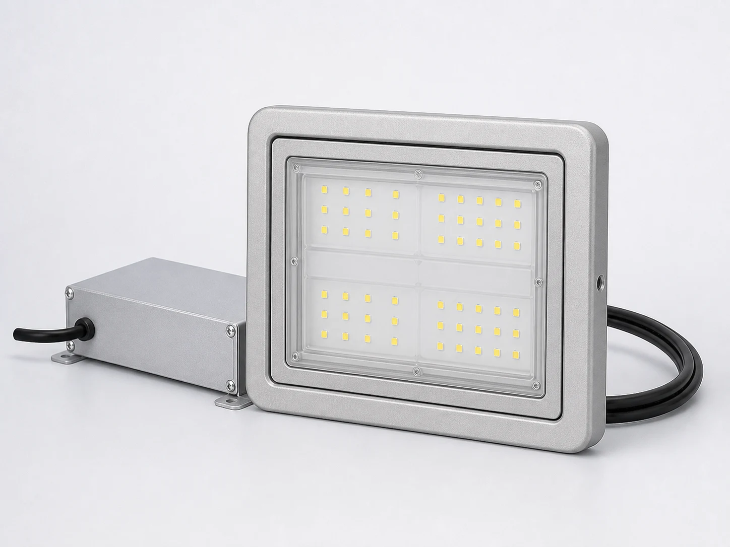 Close-up product rendering of a silver RT-IL-150C light head with a separate silver external driver